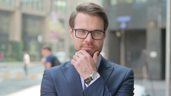 Portrait of Pensive Businessman Thinking, Getting Idea, Outdoor