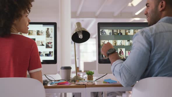 Close up view of two colleagues working in creative office