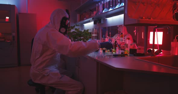 Scientists Working in Laboratory in Red Light