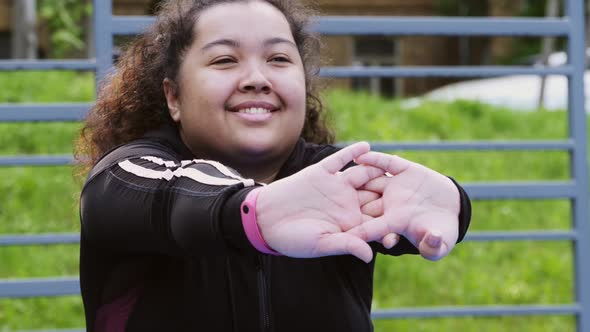 Over the Size of a Woman Doing Stretching Exercises