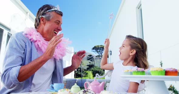 Daughter and father in fairy costume having fun 4k