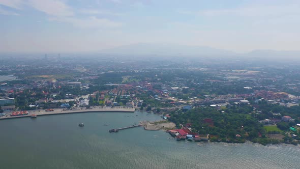 Aerial view of Ang Sila in Sri Racha district with sea, Chonburi skyline, Thailand. Urban city