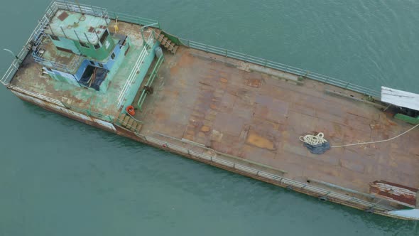 Aerial footage, moving from a top down view to a sideview of a ferry