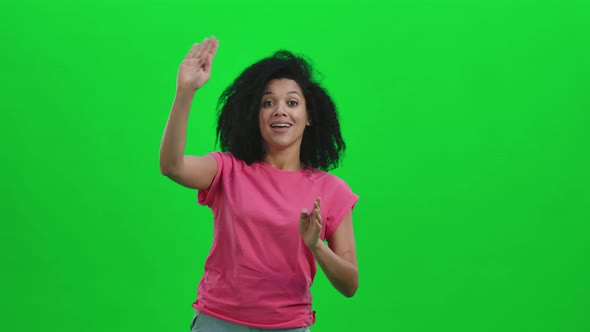 Portrait of Young Female African American Waving Hand and Showing Gesture Come Here