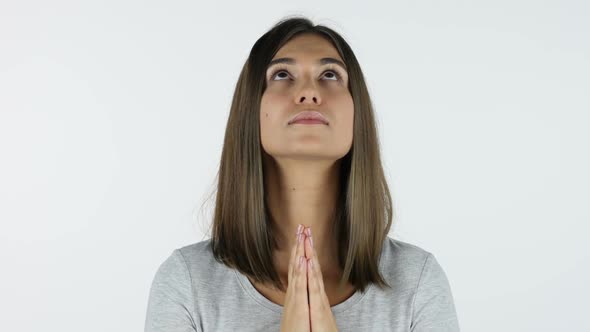 Praying Beautiful Girl for Forgiveness, White Background in Studio