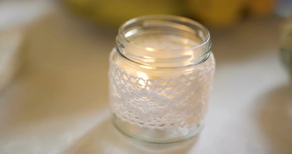 Small Lit Candle on Table