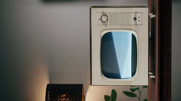 Vertical Video of Old Television with Grey Interference Screen on Home Background
