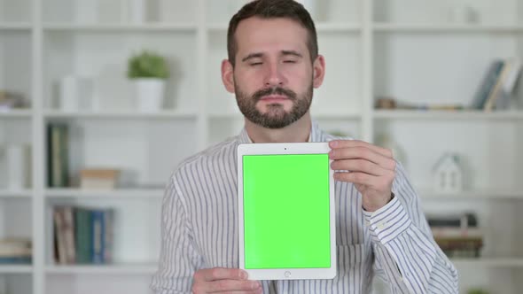 Portrait of Young Man Holding Tablet with Chroma Screen