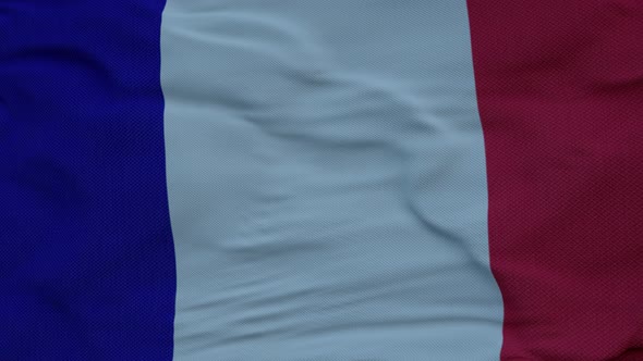 French Flag Waving in the Wind Against Deep Beautiful Clouds Sky