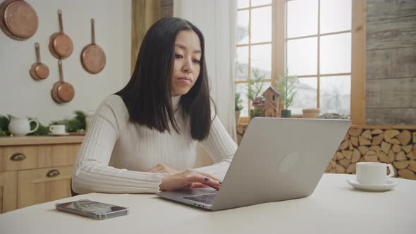 Various Faical Expressions By a Young Adult Woman While Online Shopping on Her Laptop