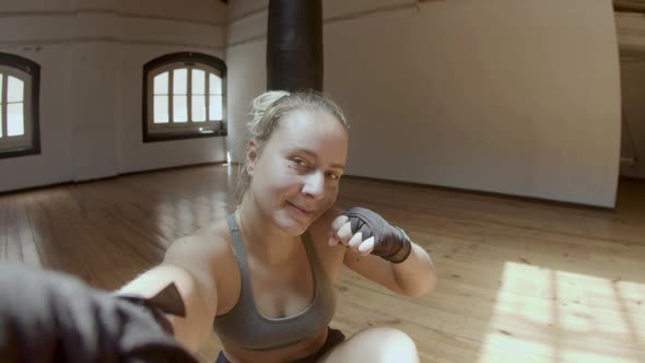 POV of Cheerful Female Boxer Taking Selfie After Workout in Gym