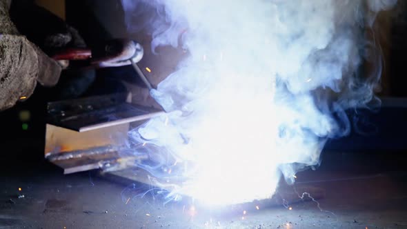 Welder welding a metal