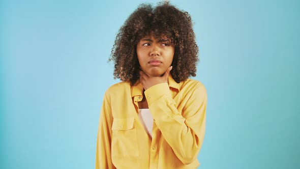 Africanamerican Female Feeling Pain in Throat and Coughing Looking Unhappy and Ill While Posing