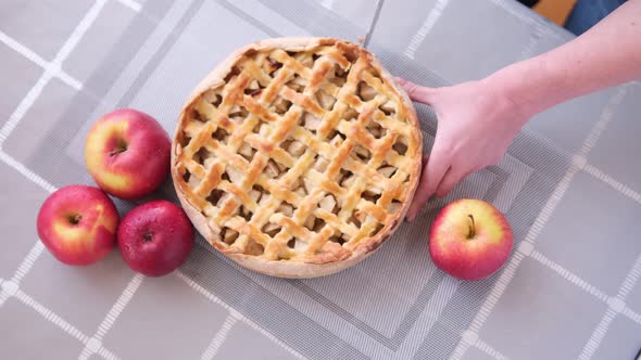 Apple Pice Cake Preparation Series  Woman Slicing Pie on a Table  Top View