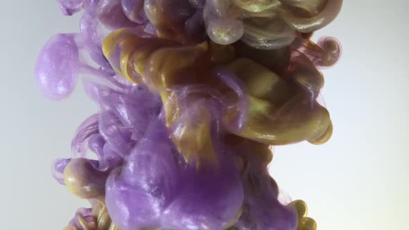 Colorful Nacreous Paint in Water Against White Background. alt