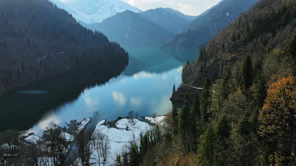 Clear Blue Mountain Lake with Reflection of Clouds on the Water