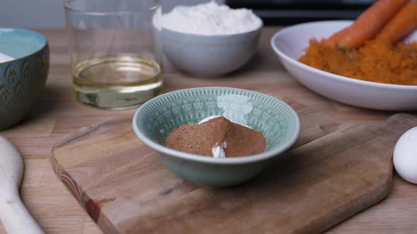 Ground Cinnamon And Baking Soda In A Bowl. Carrot Cake Baking Preparation. close up