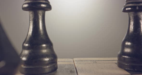 Special tracking macro shot moving between chess pieces on a chess board