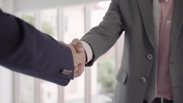 Handshake to seal a deal after a job recruitment meeting