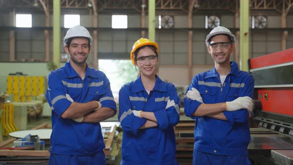 Portrait Group of male and female industrial worker working in factory.