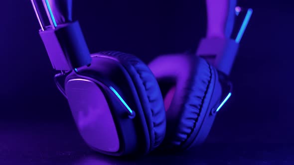 Studio headphones in a beautiful purple dynamic light.