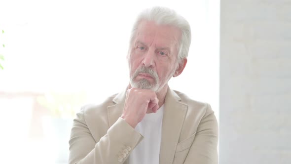 Portrait of Pensive Old Man Thinking New Plan