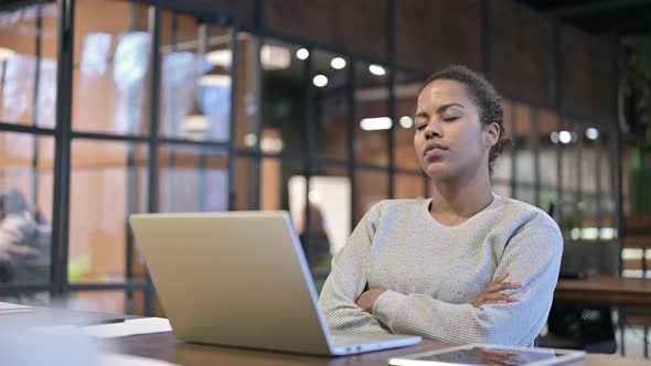 Tired African Woman Sleeping at Work