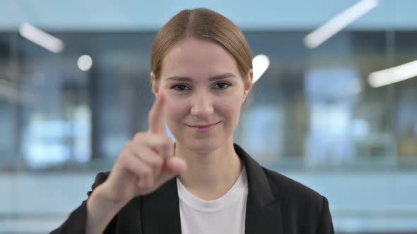 Portrait of Businesswoman Pointing at the Camera