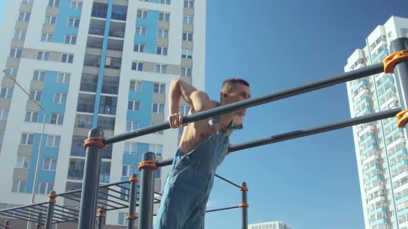 A man exercising on a sports ground