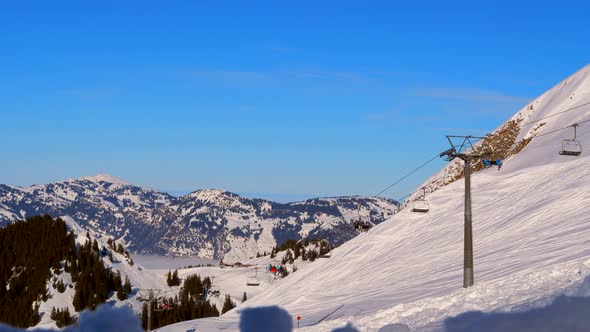 ski area in the Swiss alps with people and chairlifts in the winter ski area of ​​Beckenried