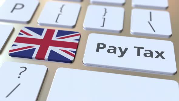 PAY TAX Text and Flag of Great Britain on the Keyboard