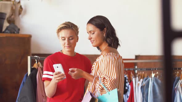 Women with Smartphone at Vintage Clothing Store 46