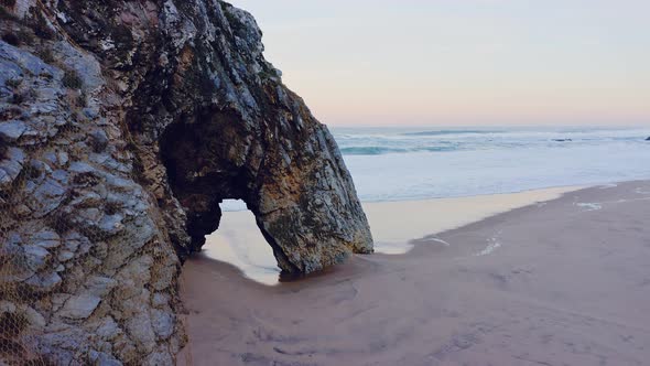 Aerial Drone View of Lisbon Beach with Arch Rock Formation, on the Portugal Coast by Sintra at Praia