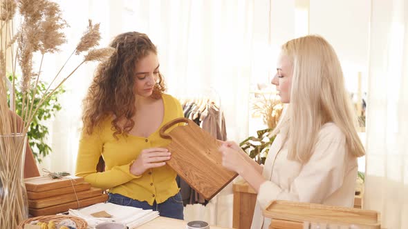 Friendly Social Young Caucasian Women in an Ecological Shop Exploring Variety of Available Products