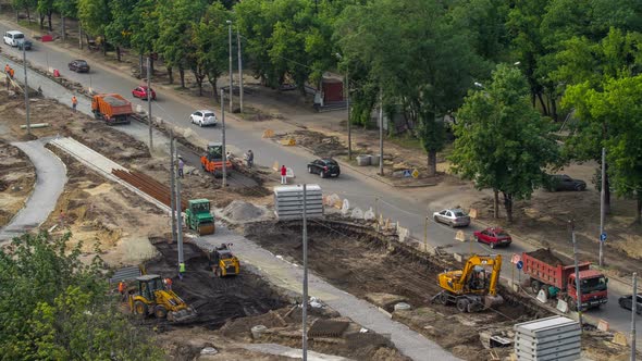 Industrial Truck Loader Excavator Moving Earth and Loading Into a Dumper Truck Timelapse