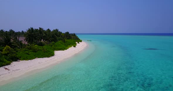 Wide above travel shot of a summer white paradise sand beach and aqua blue ocean background in color