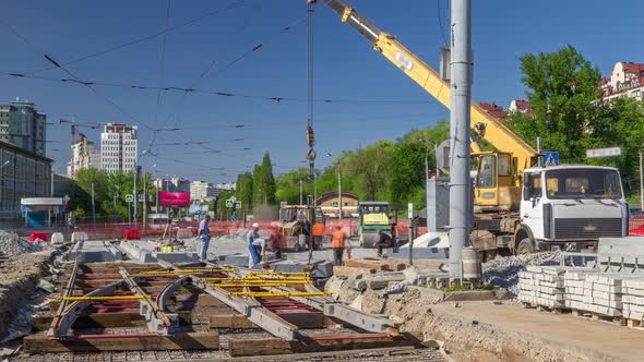 Loader Crane for Loading and Unloading Concrete Plates on a Road Construction Site Timelapse