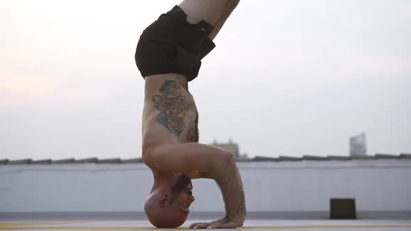 Yogi Achieves A Perfect Headstand By His Hands Supporting His Body