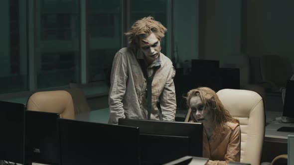 Zombies Working in Dark Office