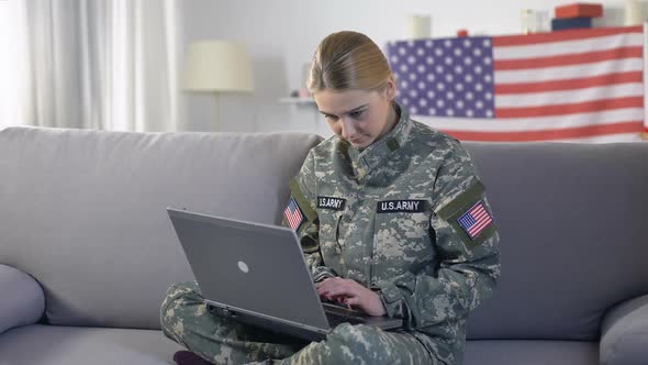 Attentive Female Soldier Student Working on Laptop PC