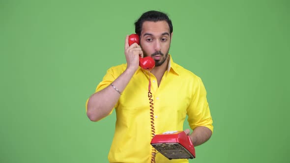 Young Angry Bearded Indian Businessman Shouting at the Phone