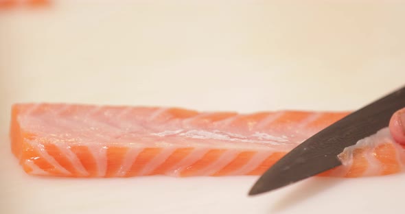 Carefully slicing fresh tuna meat - Kabuki Sushi - Slow motion