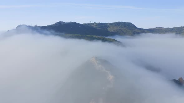 Aerial View Green Mountain Covered By Thick Fog Clouds at Sunrise, Malibu, USA