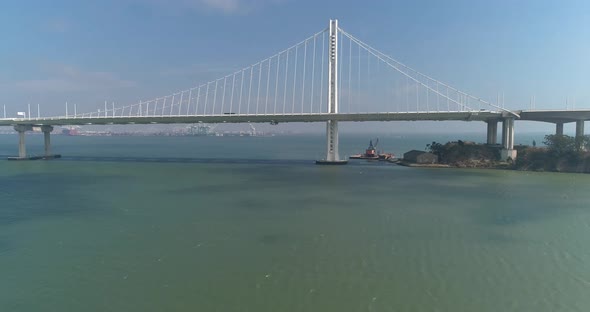 Aerial shot of vehicles moving on San Francisco–Oakland Bay Bridge with city in background