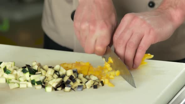 Hands Chopping Bell Pepper.