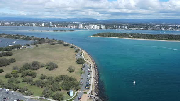 Travelling fast over the Gold Coast seaway open parks area with the man-made structure Wave break Is