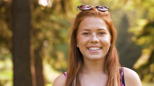 Portrait of Redhead Teenage Girl in Summer Park