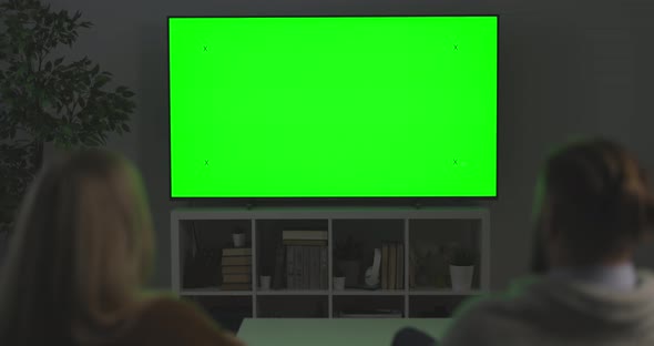 Couple Watching Green Screen TV