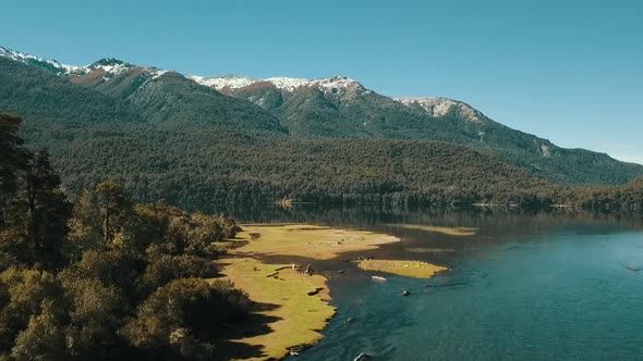 Dronees above the river to see the autumn landscape with the lake in the background.