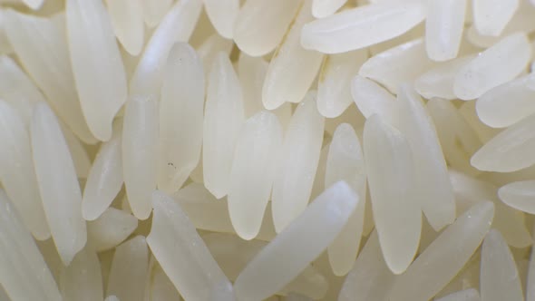 White Polished Long Rice Closeup in Macro Mode Rotates in a Circle